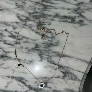 Woman’s evil eye necklace